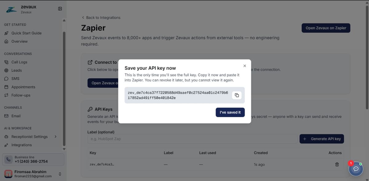 Save your API key modal showing the freshly generated zev_ key with a copy button.